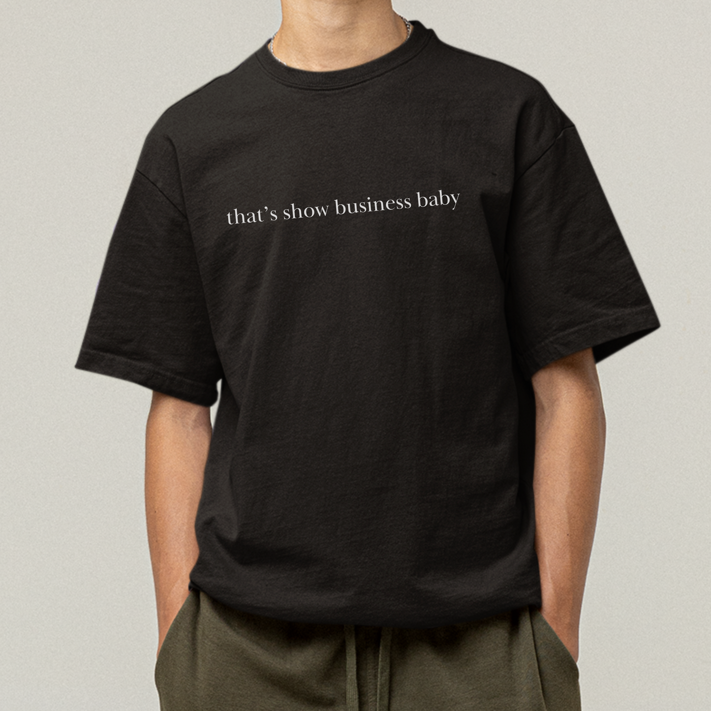 Shirtgeist That's Show Business Baby Shirt — flat lay