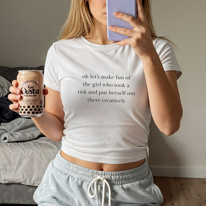 Shirtgeist Took a Risk Baby Tee — front view on model