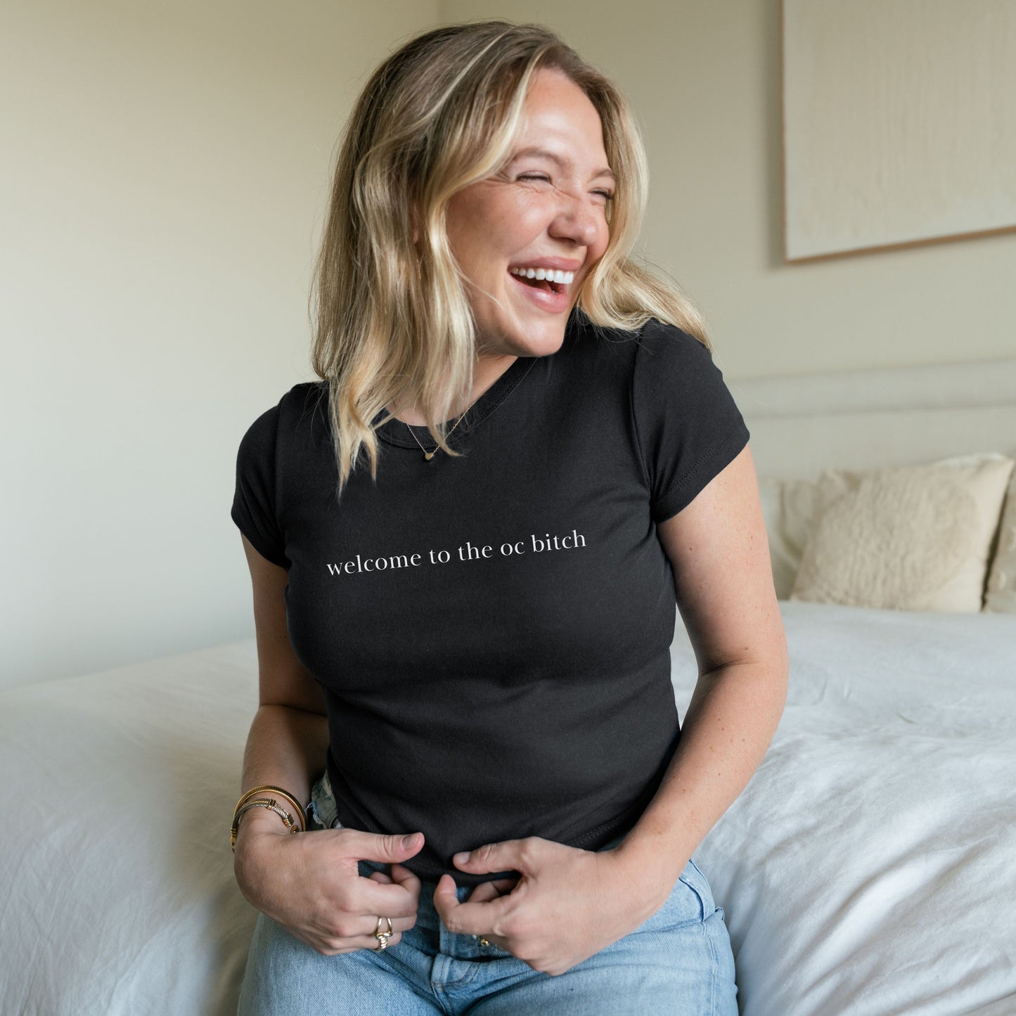 Shirtgeist Welcome to the OC Baby Tee — flat lay