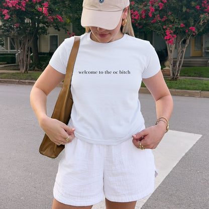 Shirtgeist Welcome to the OC Baby Tee — front view on model