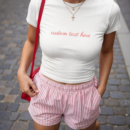 Shirtgeist Custom Text Baby Tee — front view on model